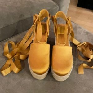 Tory Burch Gold Satin ankle wrap espadrilles.